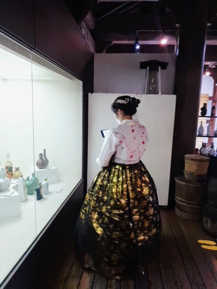 Me in a hanbok, admiring all the pretty jars